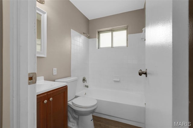 2126 Aristocrat Dr, Florissant, MO 63031 - bathroom featuring wood finished floors, toilet, vanity, and shower / bathtub combination