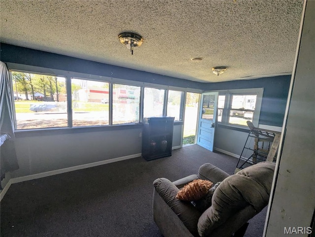 401 E Grand Ave, Campbell, MO 63933 - carpeted living room with baseboards and a textured ceiling