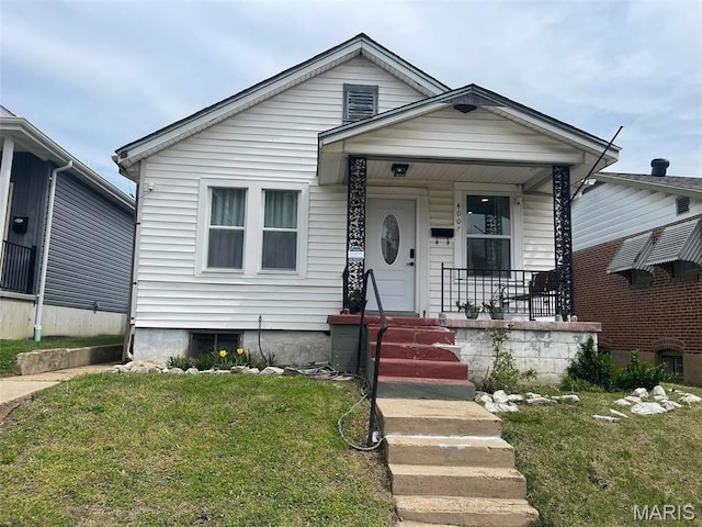 4007 Delor St, Saint Louis, MO 63116 - view of front of house featuring a porch and a front lawn