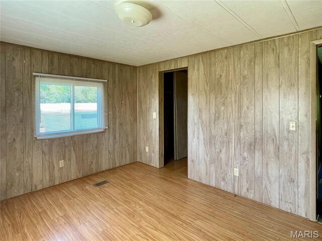 12678 Hyfield Rd, De Soto, MO 63020 - spare room with wood walls and wood finished floors