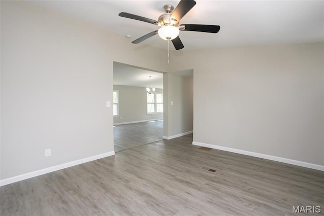 7648 Local Hillsboro Rd, Cedar Hill, MO 63016 - empty room with wood finished floors, baseboards, a ceiling fan, and vaulted ceiling