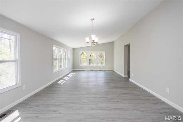 7648 Local Hillsboro Rd, Cedar Hill, MO 63016 - unfurnished dining area featuring a chandelier, vaulted ceiling, wood finished floors, and baseboards