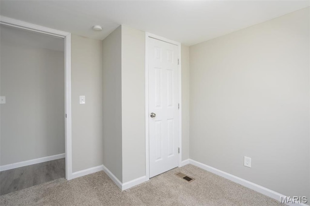 7648 Local Hillsboro Rd, Cedar Hill, MO 63016 - unfurnished bedroom featuring light carpet, baseboards, and a closet