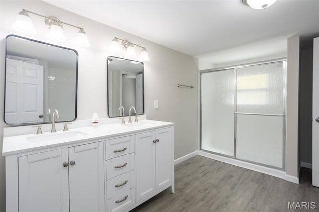 7648 Local Hillsboro Rd, Cedar Hill, MO 63016 - full bathroom with a stall shower, wood finished floors, double vanity, and baseboards