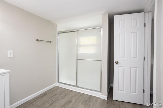7648 Local Hillsboro Rd, Cedar Hill, MO 63016 - unfurnished bedroom with a closet, wood finished floors, and baseboards