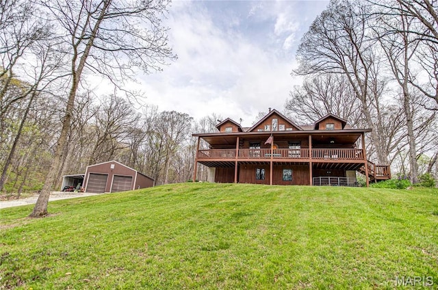234 SE 350th St, Carrollton, IL 62016 - back of house with a garage, an outdoor structure, a lawn, and a deck