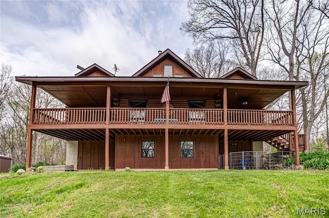 234 SE 350th St, Carrollton, IL 62016 - back of property with a wooden deck, a yard, board and batten siding, and stairway