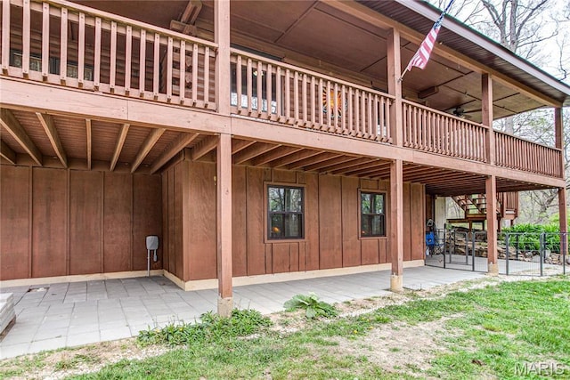 234 SE 350th St, Carrollton, IL 62016 - rear view of property featuring board and batten siding, a wooden deck, and a patio