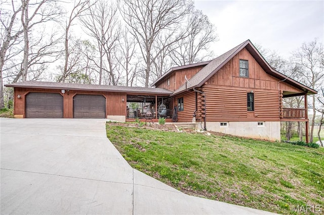 234 SE 350th St, Carrollton, IL 62016 - log-style house featuring concrete driveway, a front lawn, log siding, a garage, and a porch