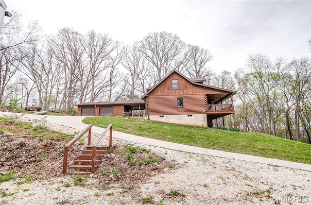234 SE 350th St, Carrollton, IL 62016 - view of side of property featuring log siding, concrete driveway, and a lawn