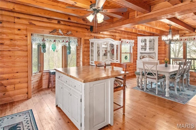 234 SE 350th St, Carrollton, IL 62016 - kitchen with beamed ceiling, light wood-type flooring, wood ceiling, white cabinetry, and ceiling fan