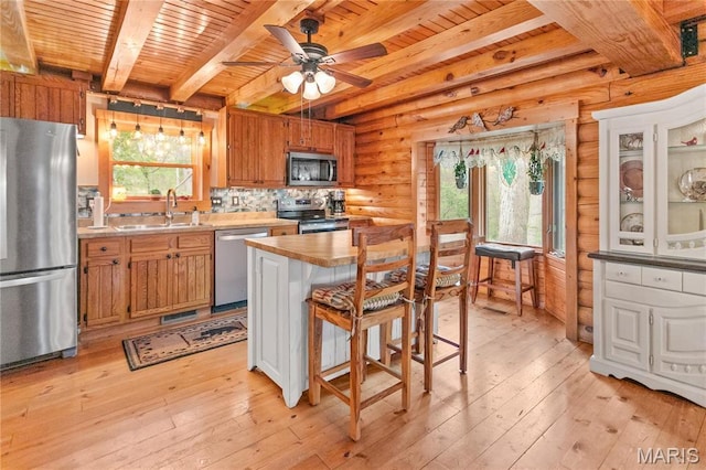 234 SE 350th St, Carrollton, IL 62016 - kitchen featuring stainless steel appliances, a sink, wood ceiling, beam ceiling, and light wood finished floors