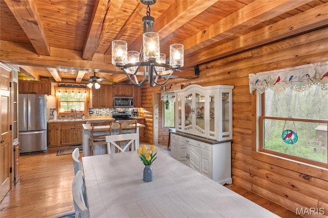 234 SE 350th St, Carrollton, IL 62016 - dining room featuring light wood finished floors, a chandelier, wood ceiling, beam ceiling, and ceiling fan