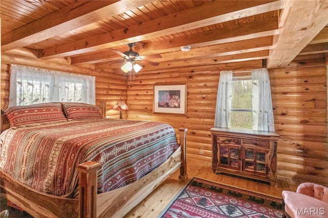 234 SE 350th St, Carrollton, IL 62016 - bedroom featuring wood-type flooring, beamed ceiling, rustic walls, and wood ceiling