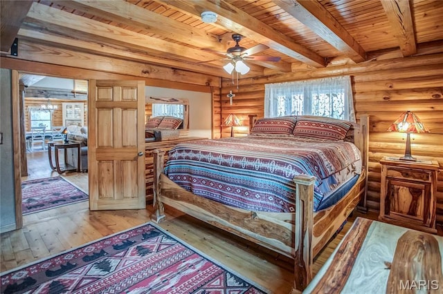 234 SE 350th St, Carrollton, IL 62016 - bedroom with multiple windows, wood ceiling, wood-type flooring, log walls, and beam ceiling