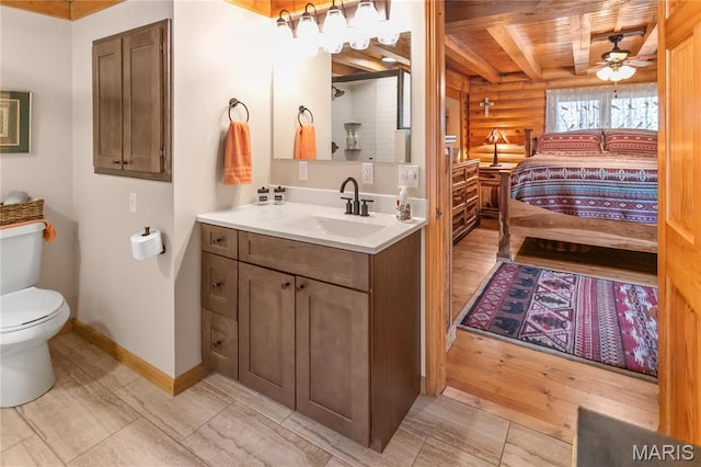 234 SE 350th St, Carrollton, IL 62016 - full bathroom with rustic walls, a shower, wood finished floors, baseboards, and toilet