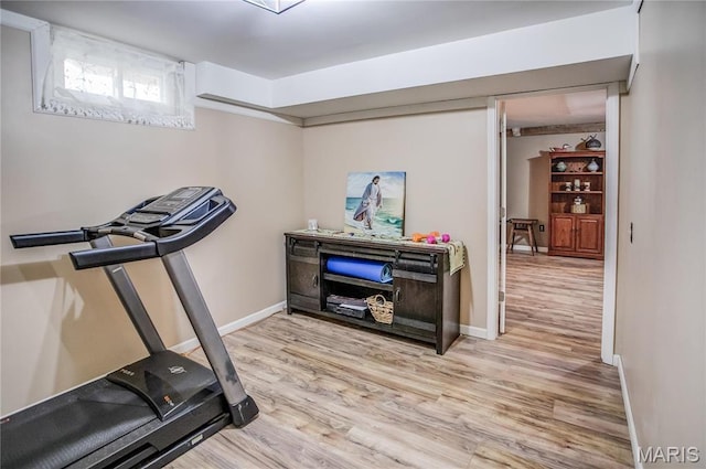 234 SE 350th St, Carrollton, IL 62016 - exercise room with light wood-style flooring and baseboards