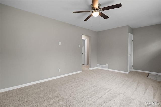 1399 Valli Ln, Saint Charles, MO 63304 - empty room featuring ceiling fan, baseboards, and light carpet