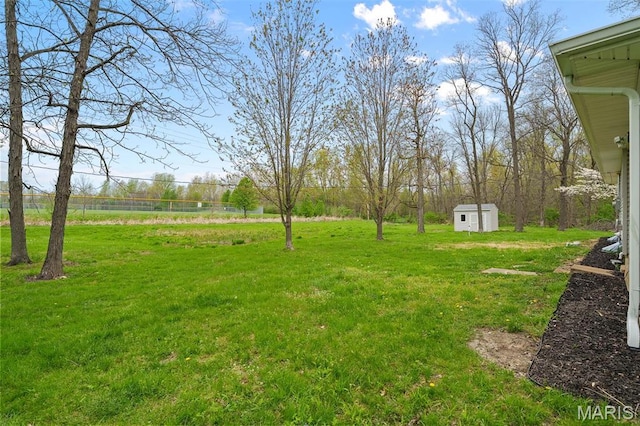 1399 Valli Ln, Saint Charles, MO 63304 - view of green lawn featuring a storage shed and an outbuilding