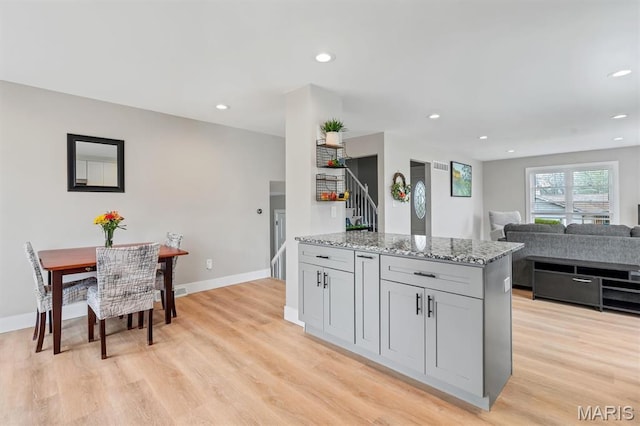 1 Picardy Dr, Lake St Louis, MO 63367 - kitchen with gray cabinetry, light stone counters, light wood-style flooring, recessed lighting, and baseboards