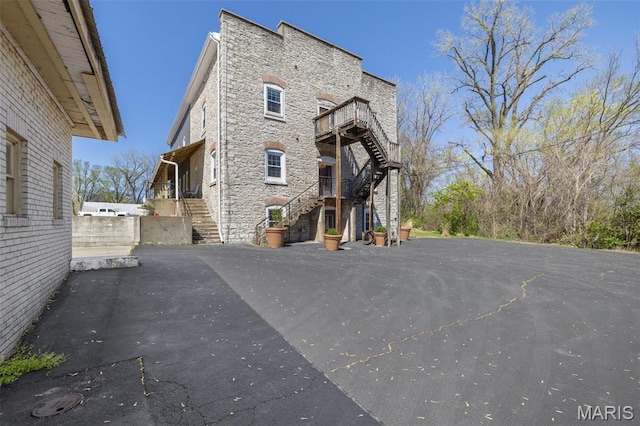 305 N Main St, Saint Genevieve, MO 63670 - view of home's exterior with stairway and stone siding