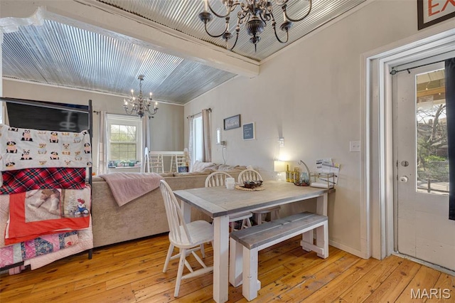 305 N Main St, Saint Genevieve, MO 63670 - dining area with a chandelier, light wood-style flooring, beam ceiling, and ornamental molding