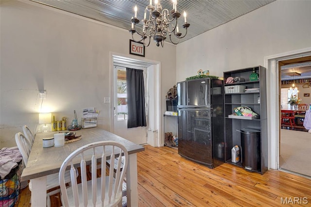 305 N Main St, Saint Genevieve, MO 63670 - dining room with a chandelier, light wood-type flooring, and healthy amount of natural light