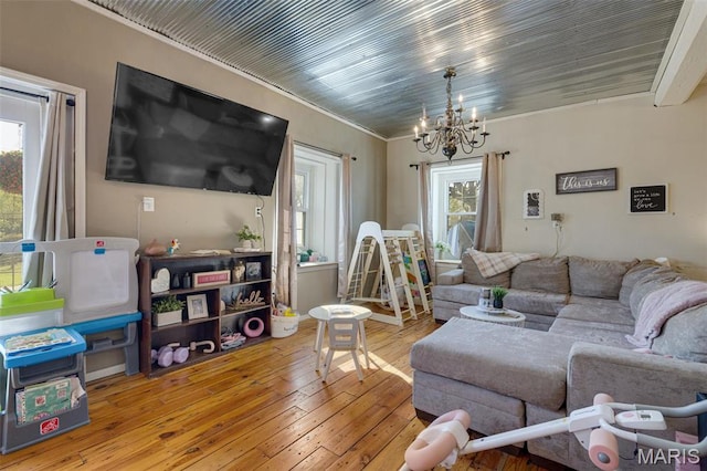 305 N Main St, Saint Genevieve, MO 63670 - living area with a chandelier, wood-type flooring, and crown molding