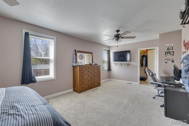 305 N Main St, Saint Genevieve, MO 63670 - carpeted bedroom featuring a walk in closet, baseboards, ceiling fan, a closet, and a desk