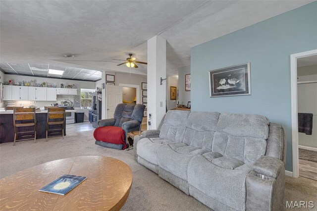 305 N Main St, Saint Genevieve, MO 63670 - living room with light carpet, a ceiling fan, and baseboards