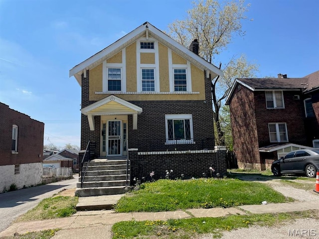 4972 Thekla Ave, Saint Louis, MO 63115 - view of front of property with a chimney and brick siding