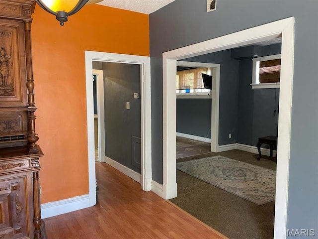 4972 Thekla Ave, Saint Louis, MO 63115 - hallway with baseboards and wood finished floors