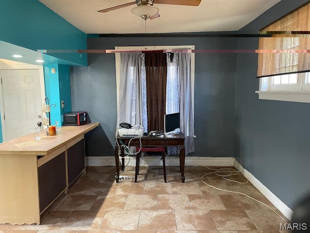 4972 Thekla Ave, Saint Louis, MO 63115 - office with a ceiling fan, baseboards, and light stone finish floors
