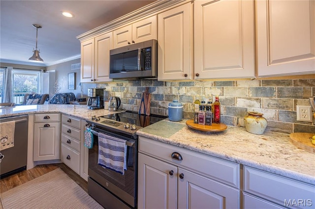 1757 Rue Marseilles, Bonne Terre, MO 63628 - kitchen featuring stainless steel appliances, crown molding, decorative backsplash, light stone countertops, and pendant lighting