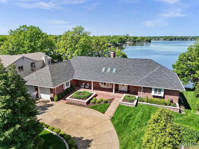 27 Lake Forest Cir, Lake St Louis, MO 63367 - view of front of home featuring brick siding, roof with shingles, a water view, and an attached garage