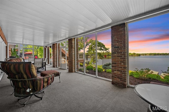 27 Lake Forest Cir, Lake St Louis, MO 63367 - sunroom / solarium with a wall of windows, carpet flooring, a water view, and outdoor dining space