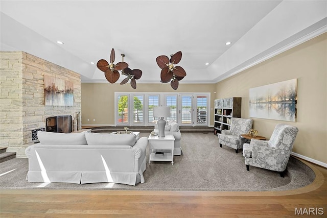 27 Lake Forest Cir, Lake St Louis, MO 63367 - living area featuring a stone fireplace, ceiling fan, recessed lighting, wood finished floors, and baseboards