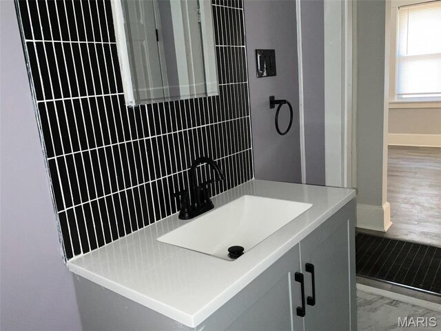 2538 Jerden Ave, Granite City, IL 62040 - bathroom with marble look tile flooring, baseboards, and vanity