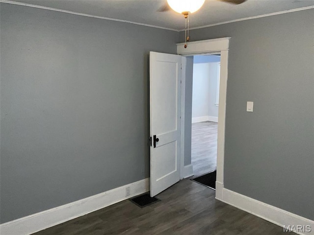 2538 Jerden Ave, Granite City, IL 62040 - unfurnished room featuring ceiling fan, dark wood-type flooring, ornamental molding, and baseboards