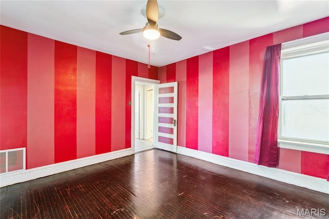 3125 Miami St, Saint Louis, MO 63118 - unfurnished room featuring wallpapered walls, baseboards, a ceiling fan, and wood finished floors