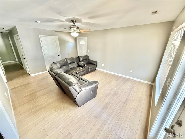113 N Long St, Bonne Terre, MO 63628 - living room featuring light wood-style floors, a ceiling fan, and baseboards