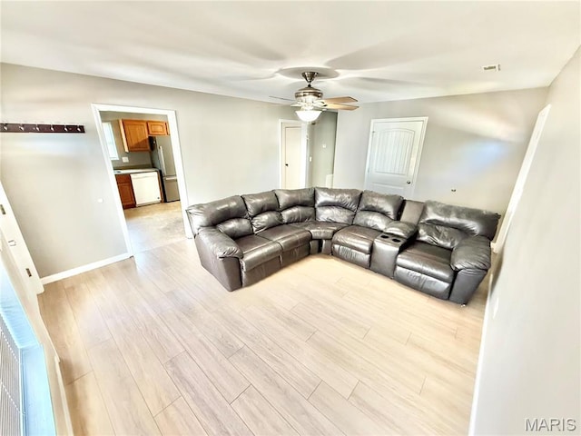 113 N Long St, Bonne Terre, MO 63628 - living area featuring ceiling fan, light wood finished floors, and baseboards