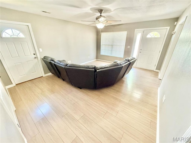113 N Long St, Bonne Terre, MO 63628 - living area featuring light wood-style flooring, baseboards, and ceiling fan