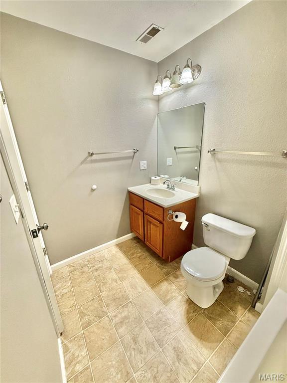 113 N Long St, Bonne Terre, MO 63628 - bathroom with toilet and vanity
