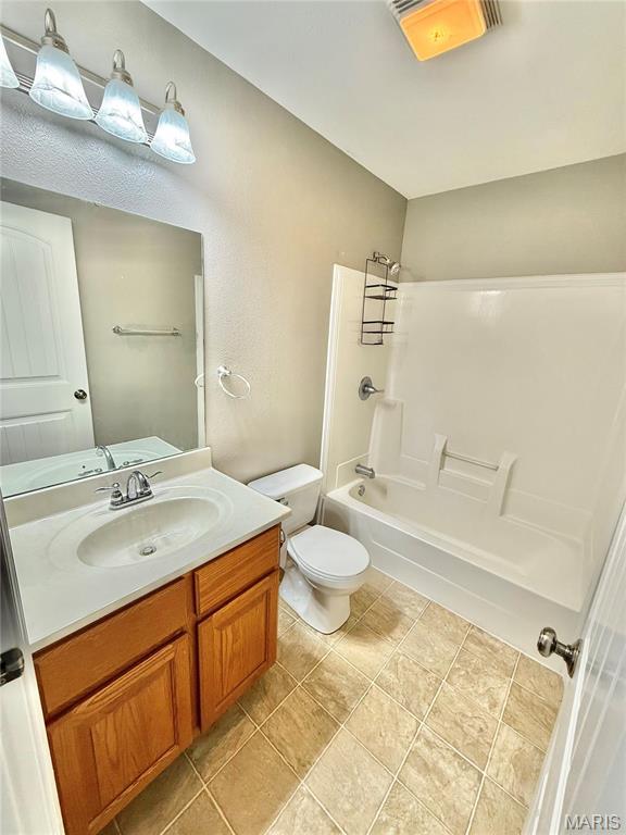 113 N Long St, Bonne Terre, MO 63628 - bathroom featuring shower / washtub combination, toilet, and vanity