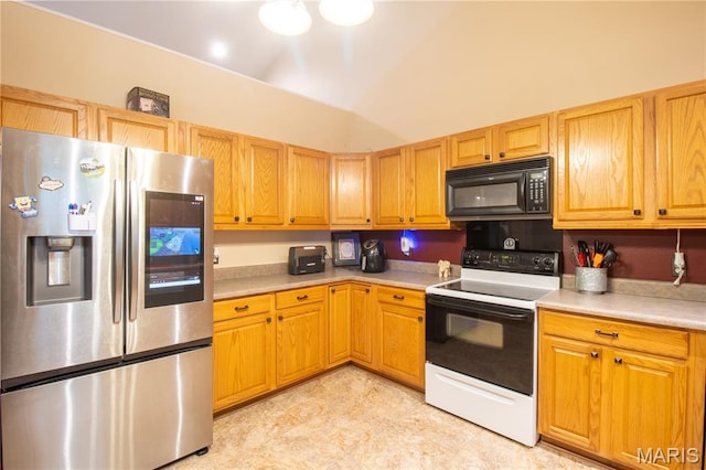 16910 Lawrence Dr, Saint Robert, MO 65584 - kitchen with stainless steel fridge, black microwave, electric stove, and light countertops