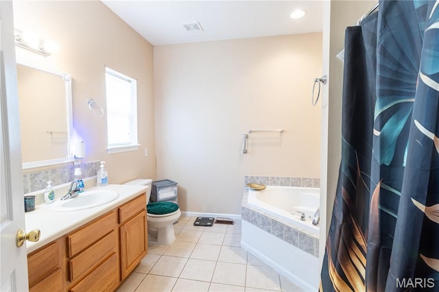 16910 Lawrence Dr, Saint Robert, MO 65584 - bathroom featuring a garden tub, vanity, and tile patterned flooring