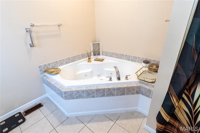 16910 Lawrence Dr, Saint Robert, MO 65584 - bathroom with a jetted tub and tile patterned flooring