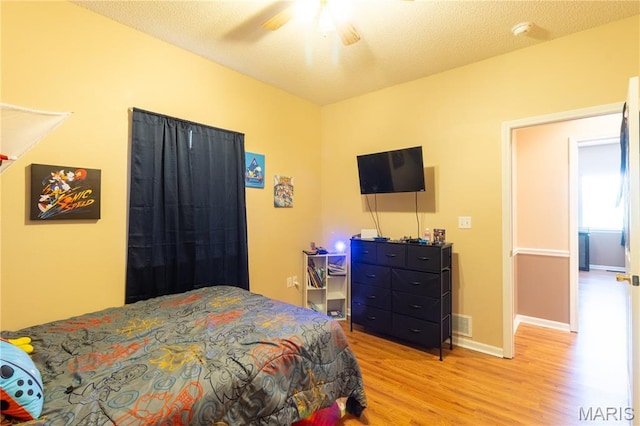 16910 Lawrence Dr, Saint Robert, MO 65584 - bedroom featuring light wood finished floors and ceiling fan