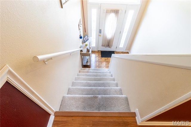 16910 Lawrence Dr, Saint Robert, MO 65584 - stairway with a textured wall and wood finished floors